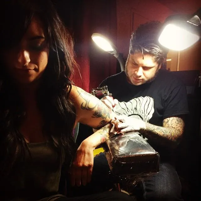 Cary Aldridge tattooing a client at his shop Memento Tattoo & Gallery in Columbus, OH